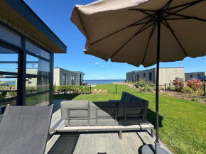 Enkhuizer Strand Chalet IJsselmeerblick Zweite Reihe mit Zaun Haus Nr 221